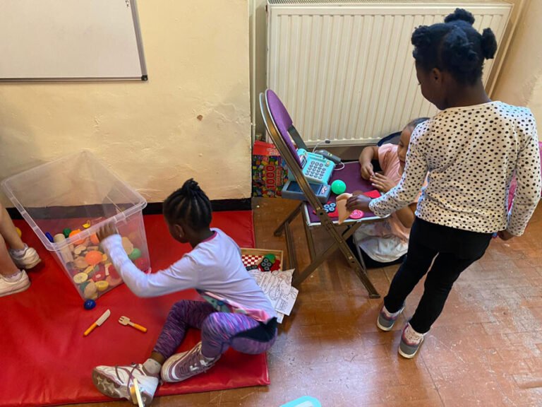 A child taking part in a supported indoor play activity