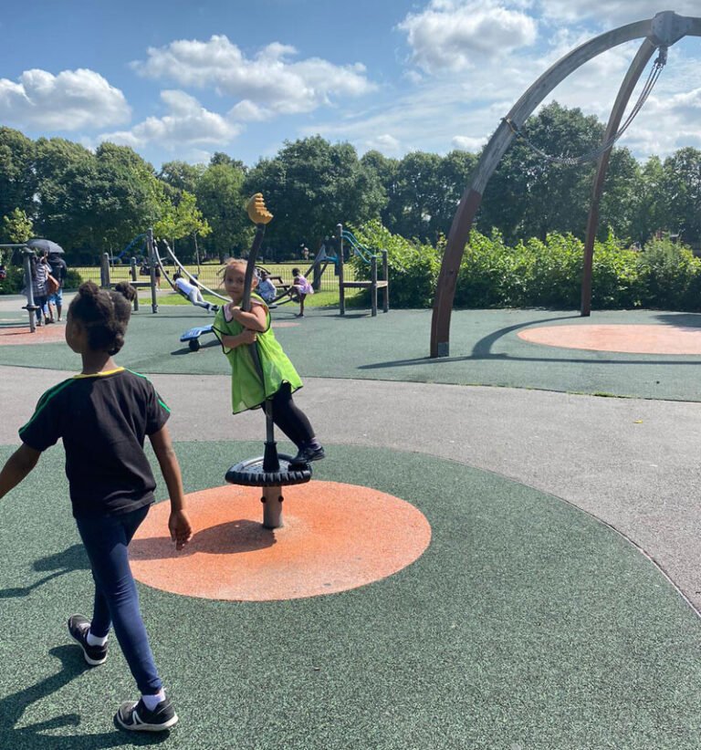 Children enjoying an outdoor target game in the playground