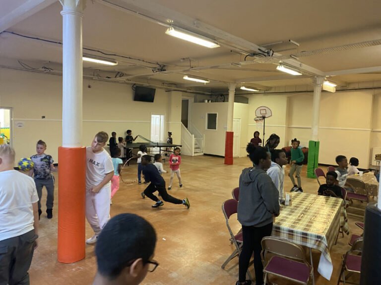 Children taking part in a lively group movement activity